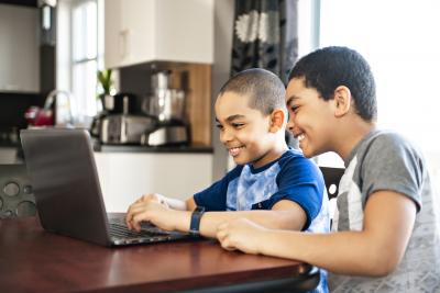 boys on computer in kitchen