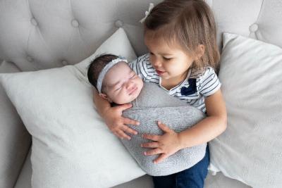 big sister holding little sister